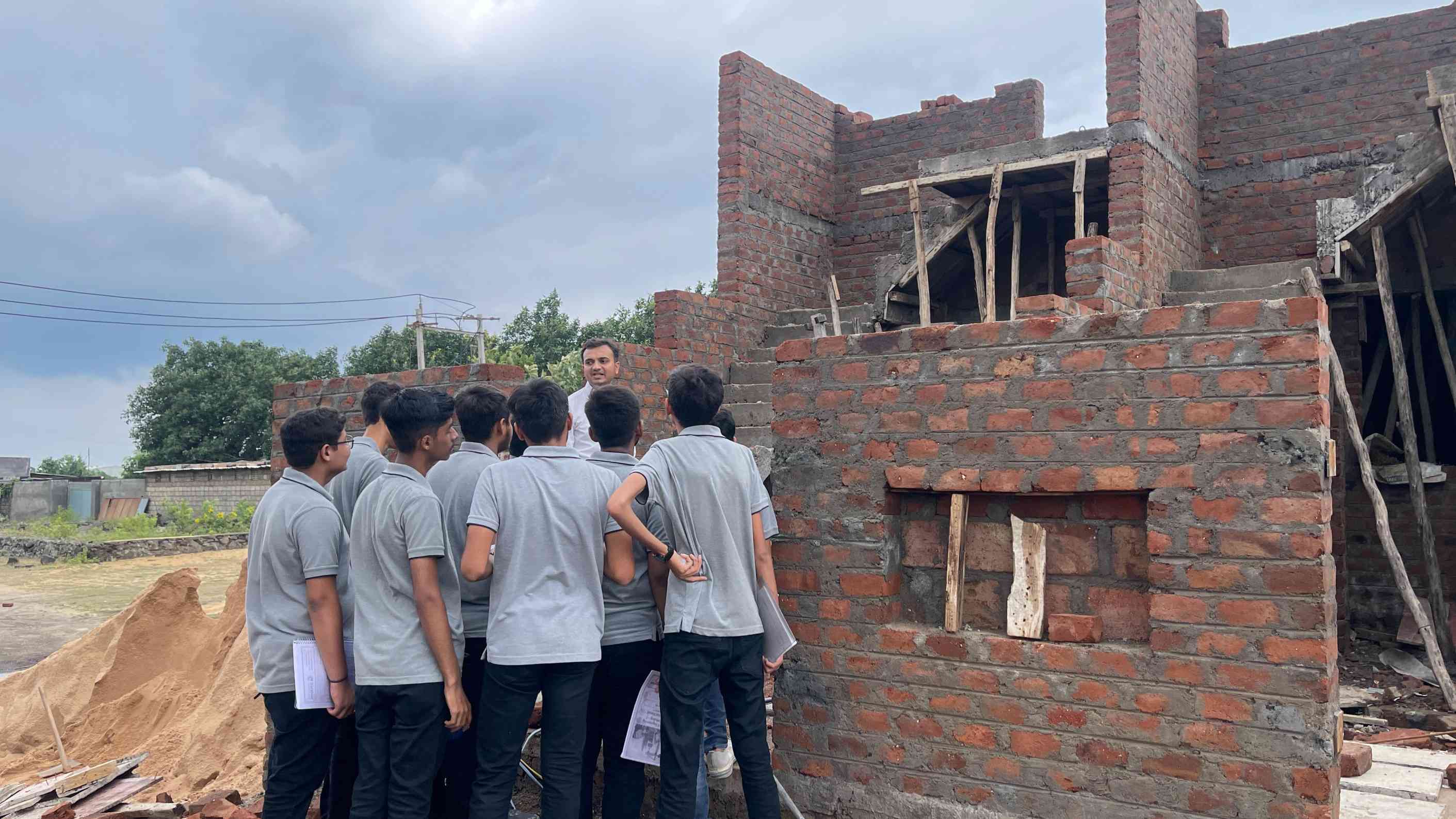 Photos of 1st semester diploma in civil engineering students visited construction site near Hadala village