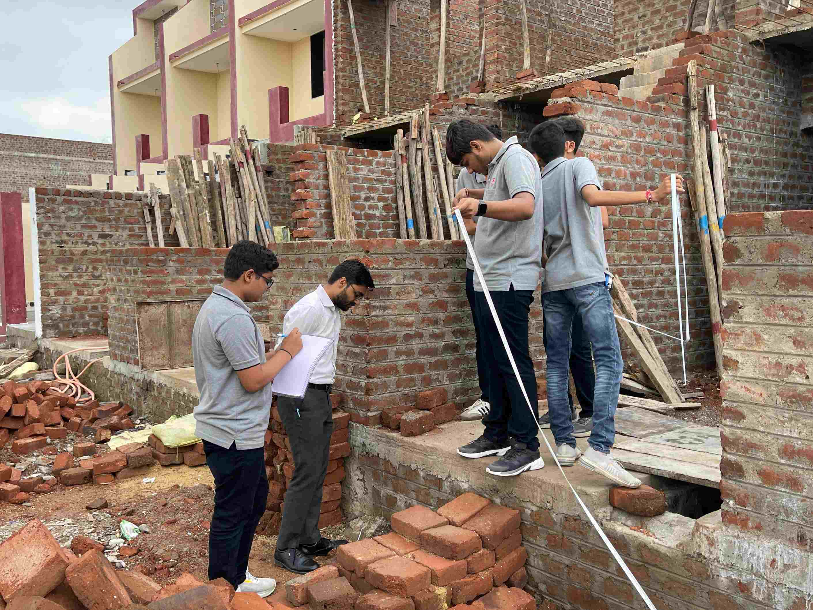 Photos of 1st semester diploma in civil engineering students visited construction site near Hadala village