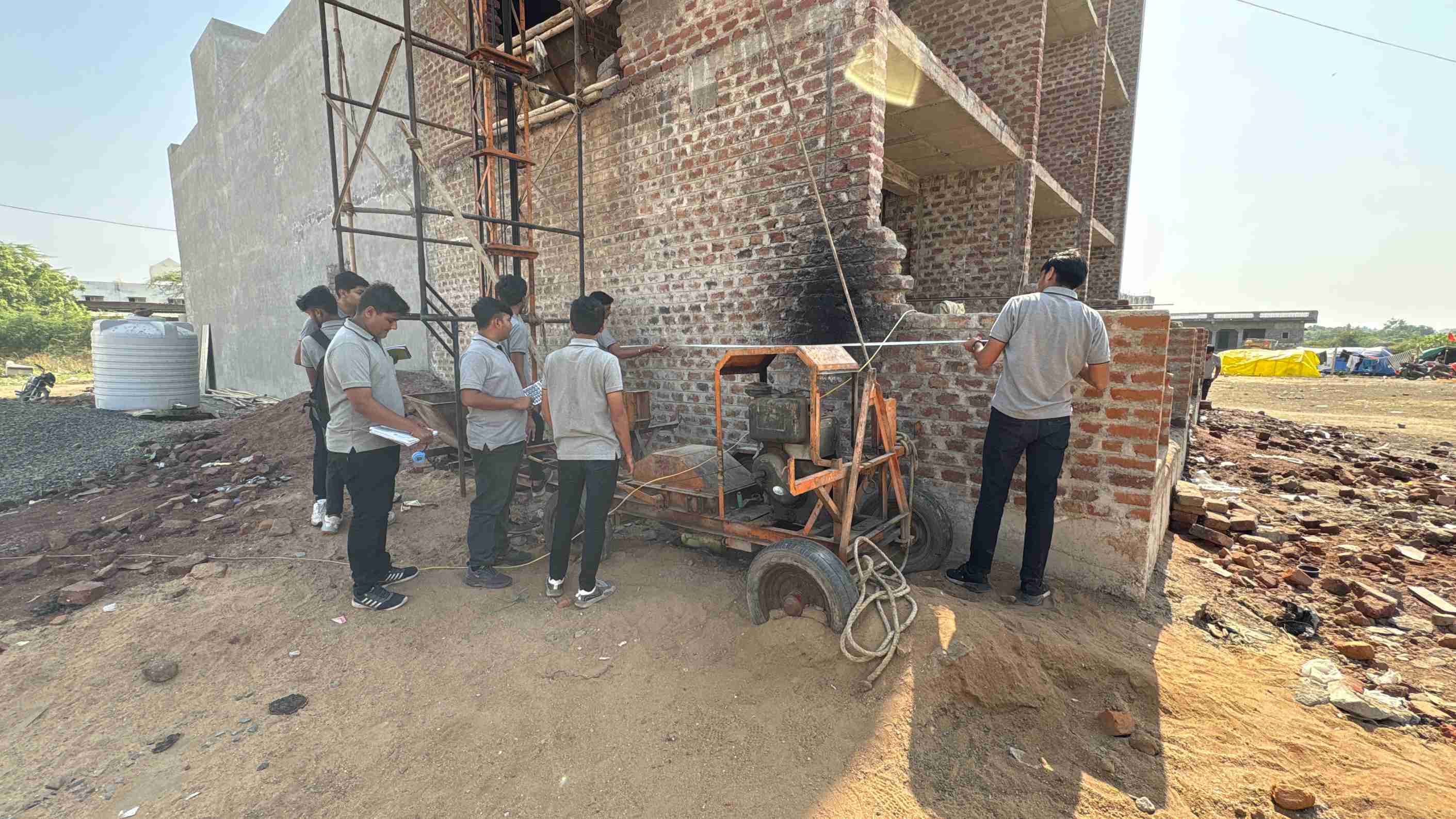 Photos of 1st semester diploma in civil engineering students visited construction site near ratanpar village