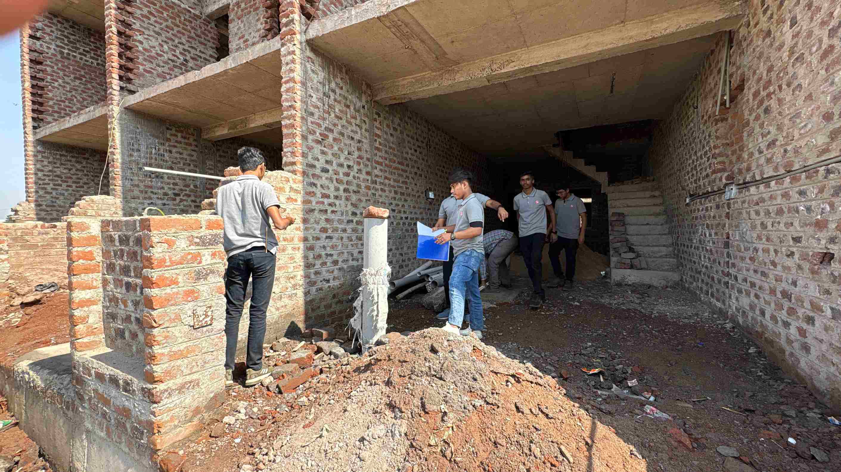 Photos of 1st semester diploma in civil engineering students visited construction site near ratanpar village
