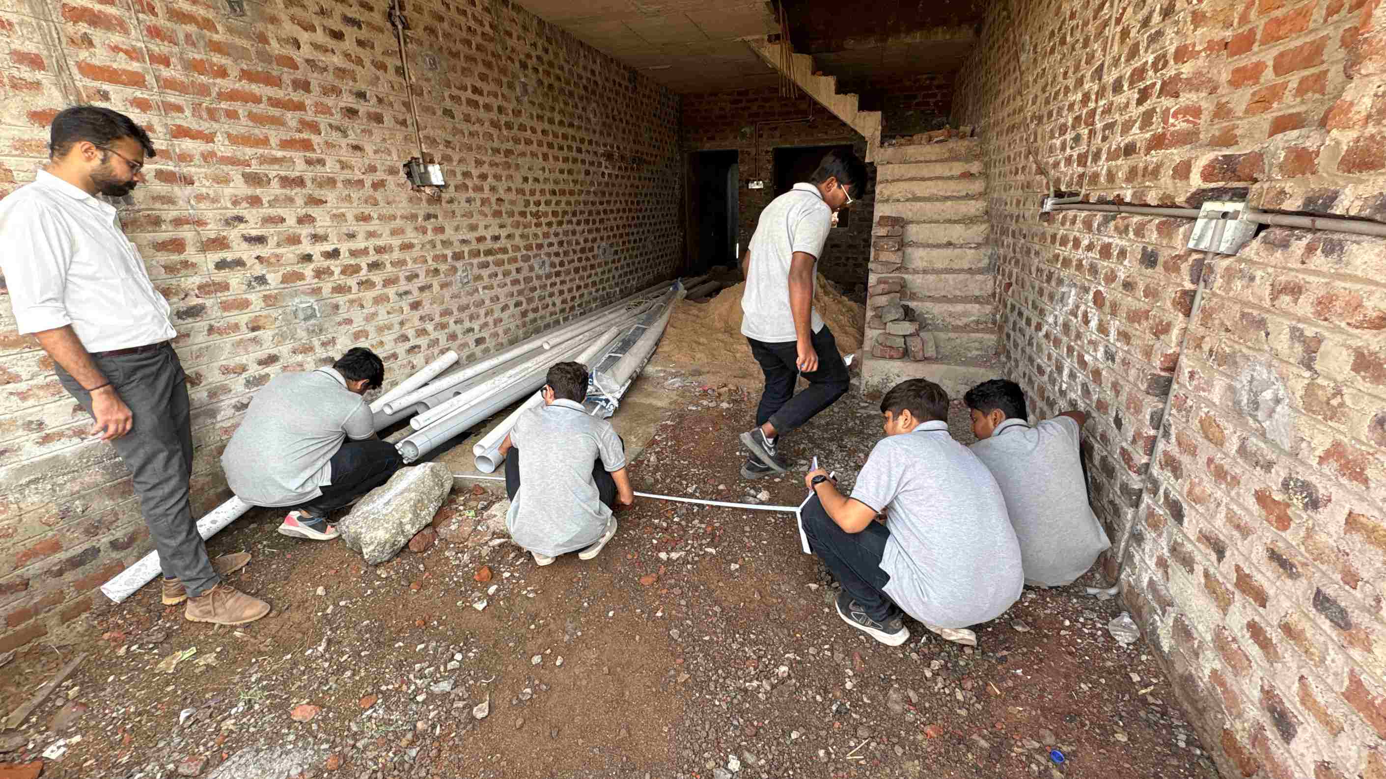 Photos of 1st semester diploma in civil engineering students visited construction site near ratanpar village