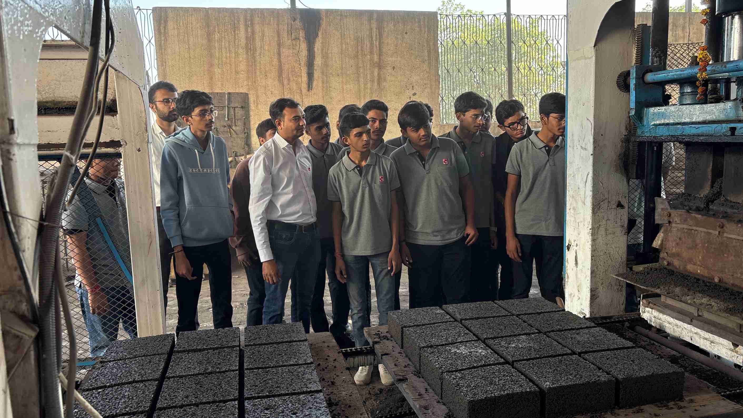 Photos of 1st semester diploma in civil engineering students visited fly ash brick plant 