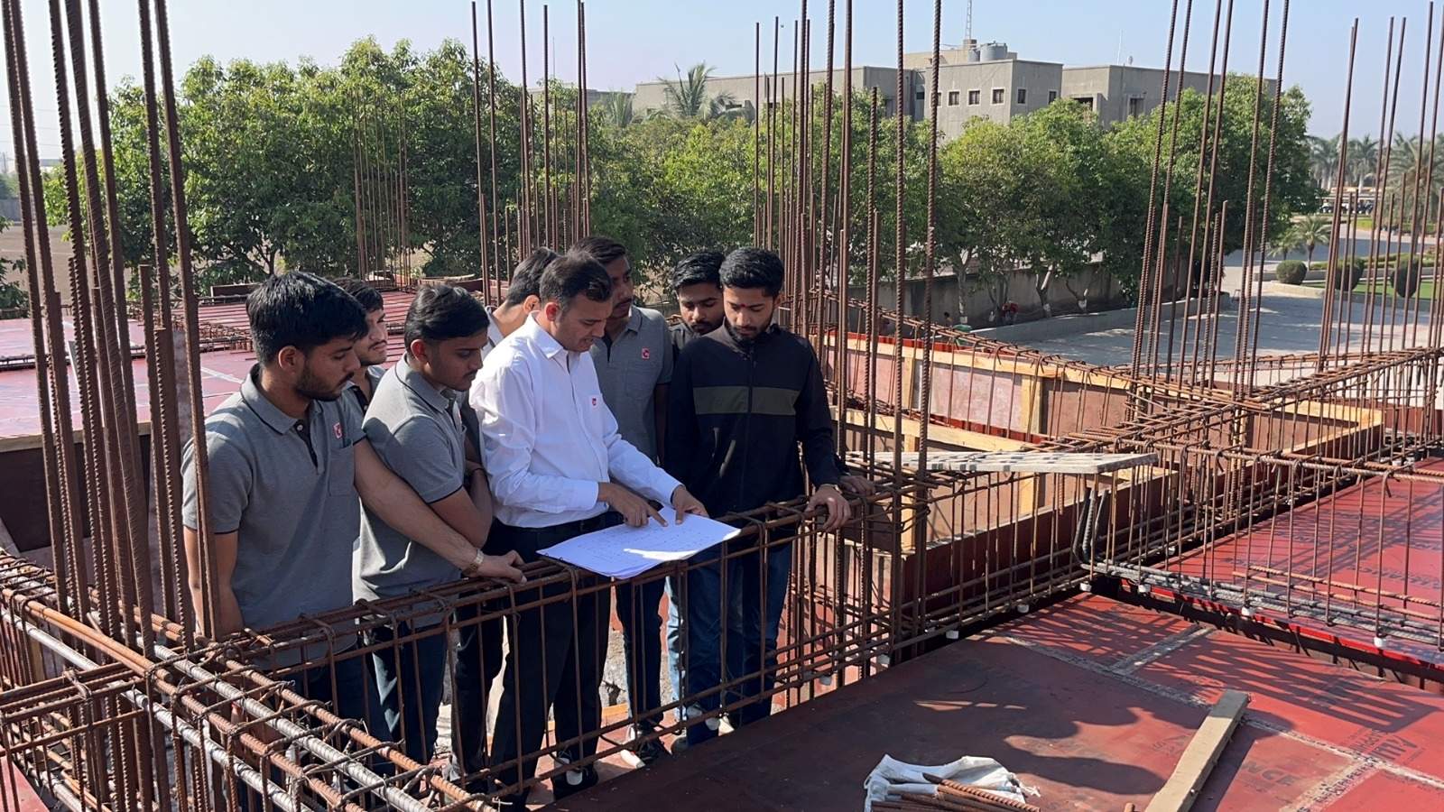 Photos of 6th semester students of diploma civil engineering visited construction site at darshan university