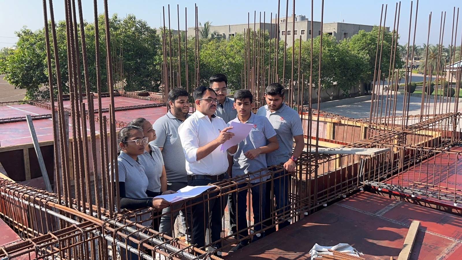 Photos of 6th semester students of diploma civil engineering visited construction site at darshan university