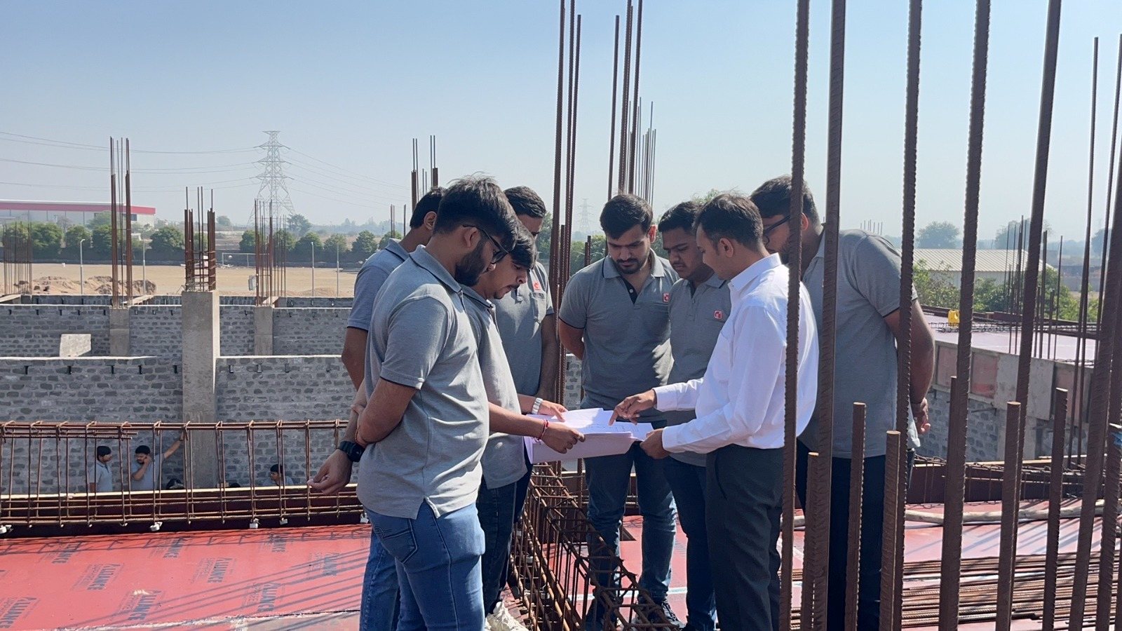 Photos of 6th semester students of diploma civil engineering visited construction site at darshan university