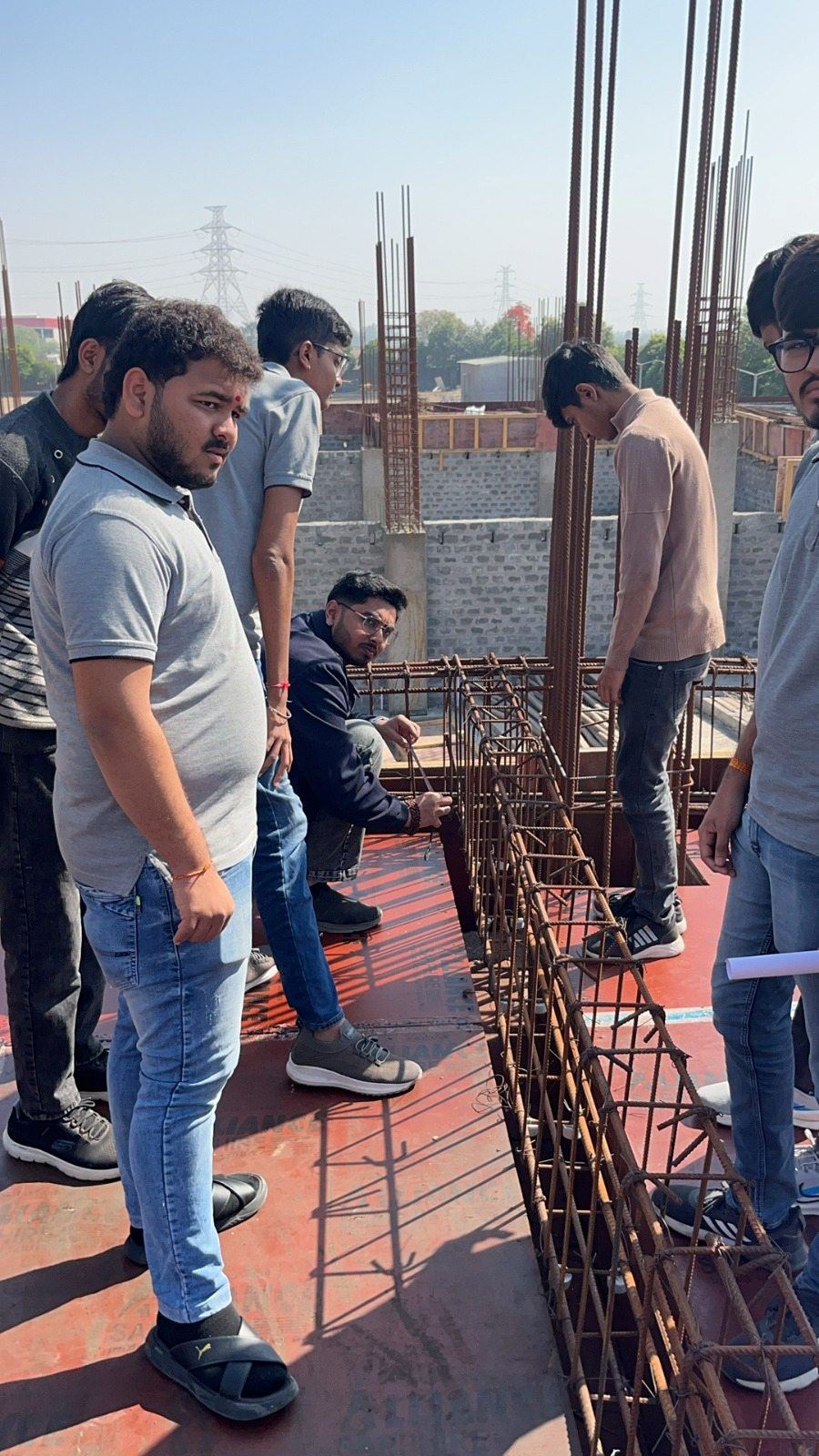 Photos of 6th semester students of diploma civil engineering visited construction site at darshan university